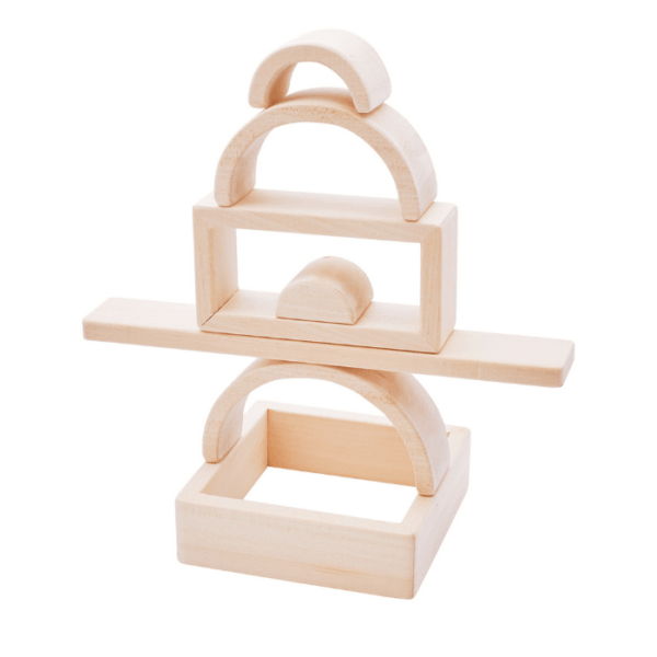 Interesting Structures built from wooden blocks are developing coordination and skills and imagination